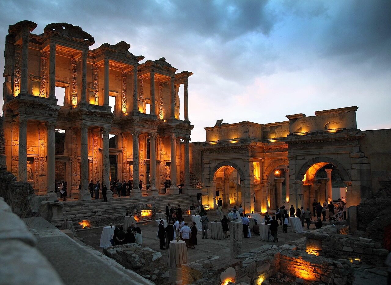 turkey, sky, clouds, celsus library, ephesus, dinner, gala, reception, buildings, structures, history, nature, historical, ruins, architecture, destinations, lights, lighting, people, tables, evening, dusk, columns, outside